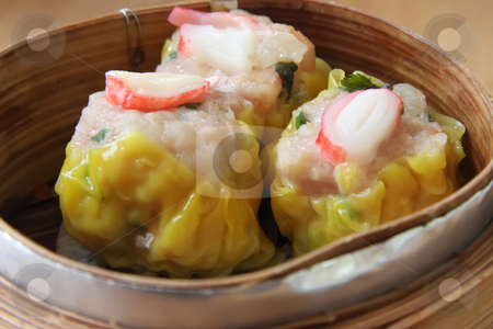 To use this stock image in your creative project, please select the size you need over to the right and click the "Add to Cart" button.
Your downloaded image will come with the Cutcaster watermark removed so don’t worry about the watermark you see on this page. Steamed dimsum stock photo, Chinese steamed dimsum in bamboo containers traditional cuisine by Kheng Guan Toh