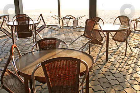 To use this stock image in your creative project, please select the size you need over to the right and click the "Add to Cart" button.
Your downloaded image will come with the Cutcaster watermark removed so don’t worry about the watermark you see on this page. Beachside cafe stock photo, Tropical style open-air cafe seaside next to beach early dawn light streaming in by Kheng Guan Toh