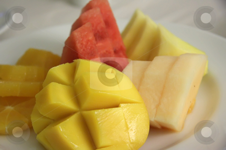 To use this stock image in your creative project, please select the size you need over to the right and click the "Add to Cart" button.
Your downloaded image will come with the Cutcaster watermark removed so don’t worry about the watermark you see on this page. Cut fruits stock photo, Assorted cut tropical fruit presentation on plate by Kheng Guan Toh