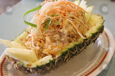 To use this stock image in your creative project, please select the size you need over to the right and click the "Add to Cart" button.
Your downloaded image will come with the Cutcaster watermark removed so don’t worry about the watermark you see on this page. Pineapple rice stock photo, Pineapple fried rice traditional thai cuisine fancy presentation by Kheng Guan Toh