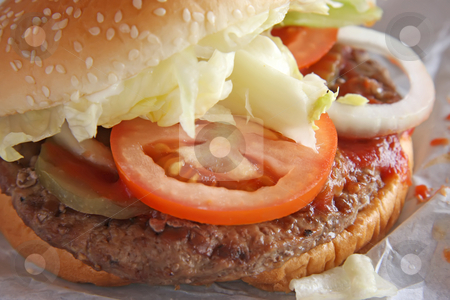 To use this stock image in your creative project, please select the size you need over to the right and click the "Add to Cart" button.
Your downloaded image will come with the Cutcaster watermark removed so don’t worry about the watermark you see on this page. Hamburger stock photo, Fastfood hamburger bun on paper wrapper by Kheng Guan Toh
