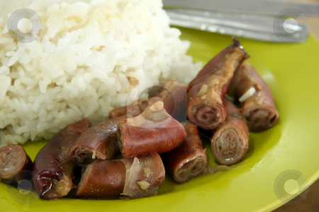 To use this stock image in your creative project, please select the size you need over to the right and click the "Add to Cart" button.
Your downloaded image will come with the Cutcaster watermark removed so don’t worry about the watermark you see on this page. Stewed intestines stock photo, Stewed pigs intestines with rice traditional Chinese cuisine by Kheng Guan Toh