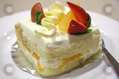 To use this stock image in your creative project, please select the size you need over to the right and click the "Add to Cart" button.
Your downloaded image will come with the Cutcaster watermark removed so don’t worry about the watermark you see on this page. Cream cake stock photo, Cream chiffon cake with fruits and icing by Kheng Guan Toh