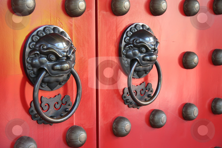 To use this stock image in your creative project, please select the size you need over to the right and click the "Add to Cart" button.
Your downloaded image will come with the Cutcaster watermark removed so don’t worry about the watermark you see on this page. Chinese temple doorway stock photo, Ornate doorways to traditional chinese temple with guardian door knockers by Kheng Guan Toh
