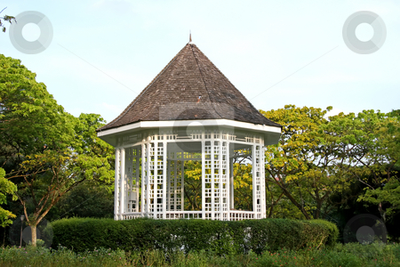 To use this stock image in your creative project, please select the size you need over to the right and click the "Add to Cart" button.
Your downloaded image will come with the Cutcaster watermark removed so don’t worry about the watermark you see on this page. Park gazebo stock photo, White ornamental gazebo ret area in park by Kheng Guan Toh