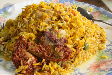 To use this stock image in your creative project, please select the size you need over to the right and click the "Add to Cart" button.
Your downloaded image will come with the Cutcaster watermark removed so don’t worry about the watermark you see on this page. Indian rice stock photo, Spicy dish of indian rice traditional cuisine by Kheng Guan Toh