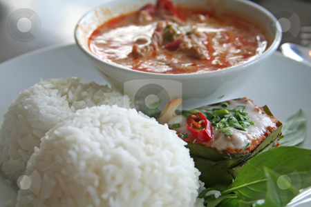To use this stock image in your creative project, please select the size you need over to the right and click the "Add to Cart" button.
Your downloaded image will come with the Cutcaster watermark removed so don’t worry about the watermark you see on this page. Thai curry stock photo, Thai dish of spicy curry steamed fish pudding and rice traditional cuisine by Kheng Guan Toh