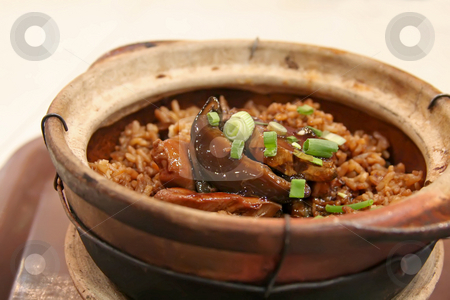To use this stock image in your creative project, please select the size you need over to the right and click the "Add to Cart" button.
Your downloaded image will come with the Cutcaster watermark removed so don’t worry about the watermark you see on this page. Claypot rice stock photo, Plate of asian squid and rice in claypot by Kheng Guan Toh