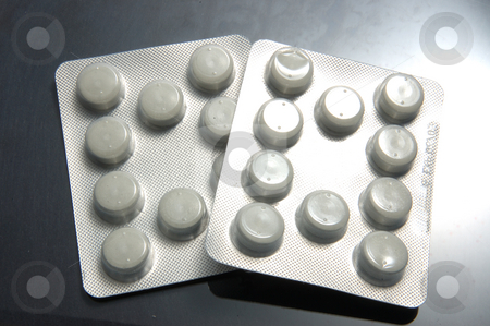 To use this stock image in your creative project, please select the size you need over to the right and click the "Add to Cart" button.
Your downloaded image will come with the Cutcaster watermark removed so don’t worry about the watermark you see on this page. Pills stock photo, Drugs on grey background by Simon Jeacle