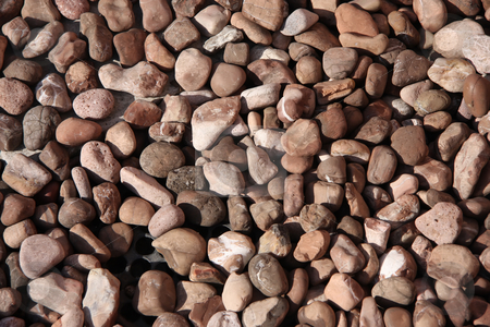 To use this stock image in your creative project, please select the size you need over to the right and click the "Add to Cart" button.
Your downloaded image will come with the Cutcaster watermark removed so don’t worry about the watermark you see on this page. Assorted pebbles stock photo, Assorted brown stone pebbles on the ground by Kheng Guan Toh
