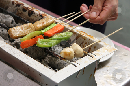 To use this stock image in your creative project, please select the size you need over to the right and click the "Add to Cart" button.
Your downloaded image will come with the Cutcaster watermark removed so don’t worry about the watermark you see on this page. Grilling food stock photo, Man's hand grilling skewered meat and vegetables by Kheng Guan Toh