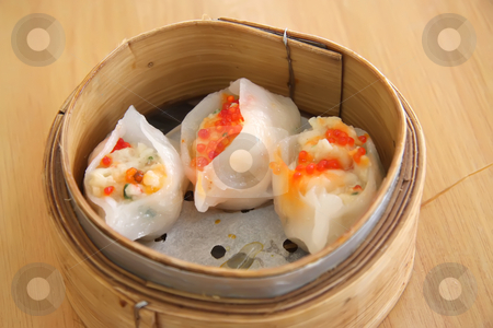 To use this stock image in your creative project, please select the size you need over to the right and click the "Add to Cart" button.
Your downloaded image will come with the Cutcaster watermark removed so don’t worry about the watermark you see on this page. Steamed dimsum stock photo, Chinese steamed dimsum in bamboo containers traditional cuisine by Kheng Guan Toh