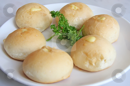 To use this stock image in your creative project, please select the size you need over to the right and click the "Add to Cart" button.
Your downloaded image will come with the Cutcaster watermark removed so don’t worry about the watermark you see on this page. Bread rolls stock photo, Bread rolls stuffed with cheese on plate by Kheng Guan Toh