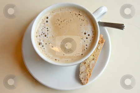 To use this stock image in your creative project, please select the size you need over to the right and click the "Add to Cart" button.
Your downloaded image will come with the Cutcaster watermark removed so don’t worry about the watermark you see on this page. Coffee with biscotti stock photo, Foamy milk coffee in round cup with biscotti by Kheng Guan Toh