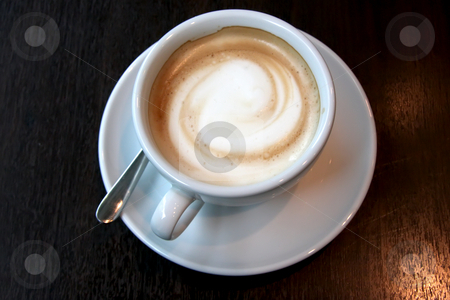 To use this stock image in your creative project, please select the size you need over to the right and click the "Add to Cart" button.
Your downloaded image will come with the Cutcaster watermark removed so don’t worry about the watermark you see on this page. Coffee with foam stock photo, Coffee with foam swirl in round white mug by Kheng Guan Toh