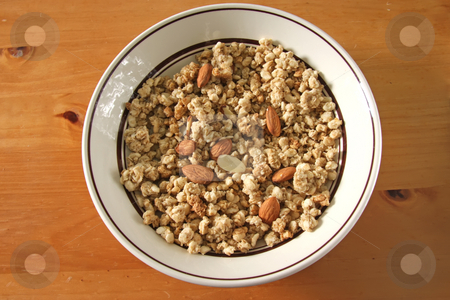 To use this stock image in your creative project, please select the size you need over to the right and click the "Add to Cart" button.
Your downloaded image will come with the Cutcaster watermark removed so don’t worry about the watermark you see on this page. Breakfast cereal stock photo, Breakfast cereal corn flakes with almonds in bowl by Kheng Guan Toh