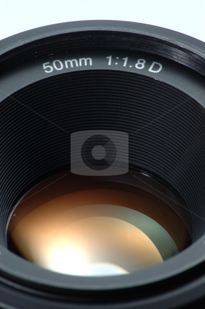To use this stock image in your creative project, please select the size you need over to the right and click the "Add to Cart" button.
Your downloaded image will come with the Cutcaster watermark removed so don’t worry about the watermark you see on this page. Lens stock photo, Standard 50mm SLR camera Lens by Simon Jeacle