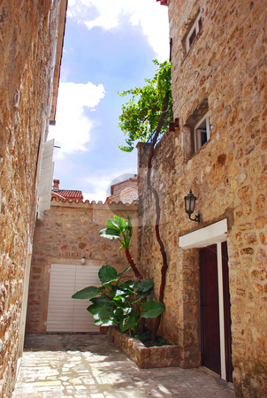 To use this stock image in your creative project, please select the size you need over to the right and click the "Add to Cart" button.
Your downloaded image will come with the Cutcaster watermark removed so don’t worry about the watermark you see on this page. Old stone town in Montenegro - Budva stock photo, Old stone houses exterior in Budva, Montenegro by Julija Sapic