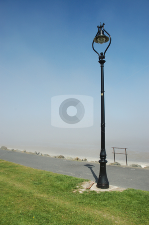 To use this stock image in your creative project, please select the size you need over to the right and click the "Add to Cart" button.
Your downloaded image will come with the Cutcaster watermark removed so don’t worry about the watermark you see on this page. Lampost stock photo, Lampost on Sandymount strand looking over Dublin Bay, Ireland by Simon Jeacle