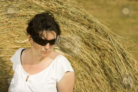 To use this stock image in your creative project, please select the size you need over to the right and click the "Add to Cart" button.
Your downloaded image will come with the Cutcaster watermark removed so don’t worry about the watermark you see on this page. Young woman sitting on hay bail stock photo, Young woman by Ivan Montero