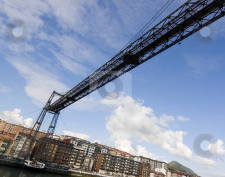 To use this stock image in your creative project, please select the size you need over to the right and click the "Add to Cart" button.
Your downloaded image will come with the Cutcaster watermark removed so don’t worry about the watermark you see on this page. Tourism transportation bridge stock photo, Hanging bridge of portugalete is the oldest hanging bridge of the world and it is unesco patrimony of humanity by Ivan Montero