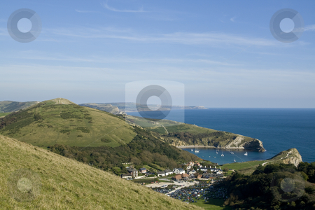 To use this stock image in your creative project, please select the size you need over to the right and click the "Add to Cart" button.
Your downloaded image will come with the Cutcaster watermark removed so don’t worry about the watermark you see on this page. View over Lulworth Cove,Dorset,England stock photo, View over Lulworth Cove,Dorset,England from the high point of the coastal path. Lulworth cove is a useful shelter for small boats and yachts, a popular holiday destination and a part of the Jurrasic coast a World Heritage site by Chris Pole