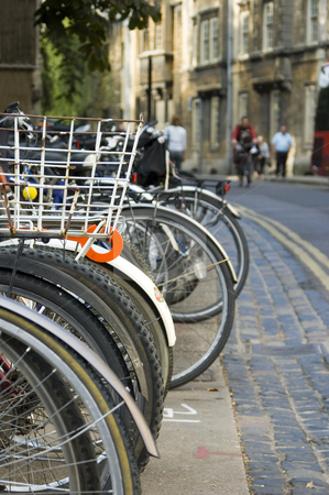 To use this stock image in your creative project, please select the size you need over to the right and click the "Add to Cart" button.
Your downloaded image will come with the Cutcaster watermark removed so don’t worry about the watermark you see on this page. Bikes Parked in the Street (Oxford) stock photo, A row of bikes parked on the street in Oxford (England) by Lee Torrens