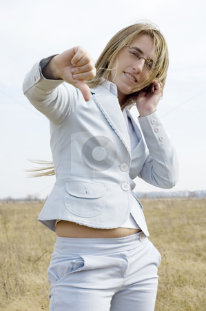 To use this stock image in your creative project, please select the size you need over to the right and click the "Add to Cart" button.
Your downloaded image will come with the Cutcaster watermark removed so don’t worry about the watermark you see on this page. No we didn't get it stock photo, A young businesswoman speaking on a phone on a farm giving the thumbs down. by Lee Torrens
