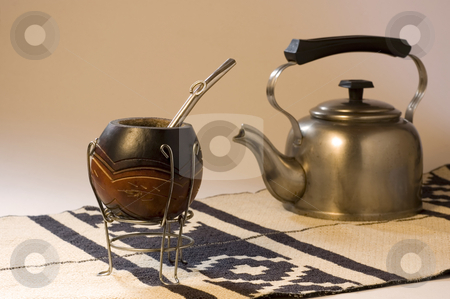 To use this stock image in your creative project, please select the size you need over to the right and click the "Add to Cart" button.
Your downloaded image will come with the Cutcaster watermark removed so don’t worry about the watermark you see on this page. Yerba Mate Scene stock photo, An Argentinean Yerba Mate scene, including a kettle and a typical South American rug. Focus on Mate Gourd by Lee Torrens