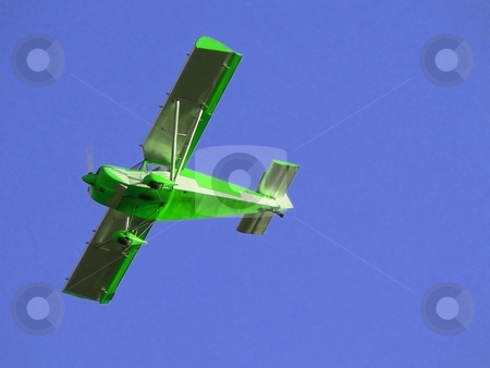 To use this stock image in your creative project, please select the size you need over to the right and click the "Add to Cart" button.
Your downloaded image will come with the Cutcaster watermark removed so don’t worry about the watermark you see on this page. Green plane stock photo, Small green airplane flying over blue sky by Laurent Dambies