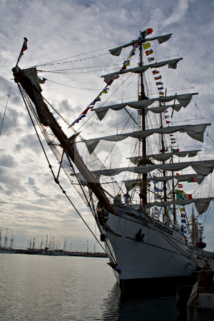 To use this stock image in your creative project, please select the size you need over to the right and click the "Add to Cart" button.
Your downloaded image will come with the Cutcaster watermark removed so don’t worry about the watermark you see on this page. Tall ships Regatta - Funchal 500 years stock photo, Some of the biggest tall ships in the world that participate at the tall ships regatta 500 years of the discovery of Funchal Island.
CUAUHT?MOC ship and crew in the sunset. Ilhavo dock, 20 of September 2008. by Paulo Resende