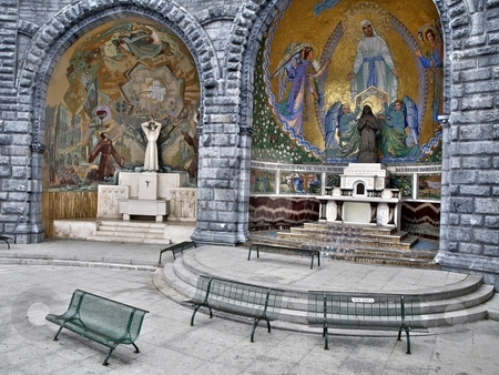 To use this stock image in your creative project, please select the size you need over to the right and click the "Add to Cart" button.
Your downloaded image will come with the Cutcaster watermark removed so don’t worry about the watermark you see on this page. Catholic Pilgrimage stock photo, Prayer area just outside the Grotto in Lourdes by Laurent Dambies