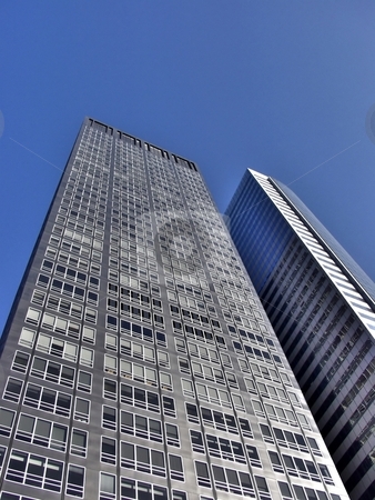 To use this stock image in your creative project, please select the size you need over to the right and click the "Add to Cart" button.
Your downloaded image will come with the Cutcaster watermark removed so don’t worry about the watermark you see on this page. Two skyscrapers street view stock photo, Two modern skyscrapers under clear blue sky by Laurent Dambies
