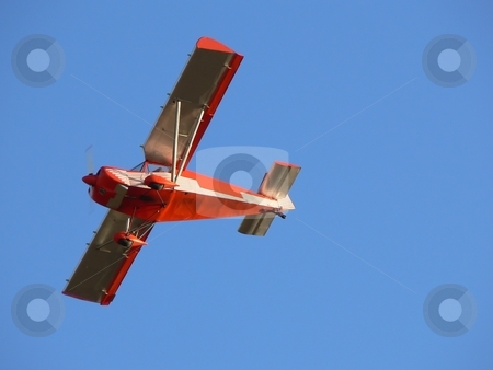 To use this stock image in your creative project, please select the size you need over to the right and click the "Add to Cart" button.
Your downloaded image will come with the Cutcaster watermark removed so don’t worry about the watermark you see on this page. Red plane stock photo, Small red airplane flying over blue sky by Laurent Dambies