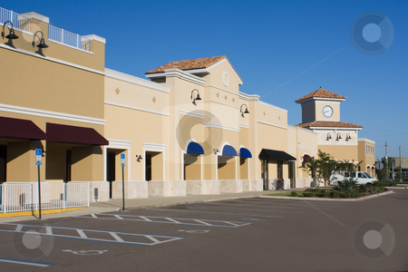To use this stock image in your creative project, please select the size you need over to the right and click the "Add to Cart" button.
Your downloaded image will come with the Cutcaster watermark removed so don’t worry about the watermark you see on this page. Upscale pastel commercial mall stock photo, Upscale pastel strip mall with awnings and corner clock tower by Lee Barnwell
