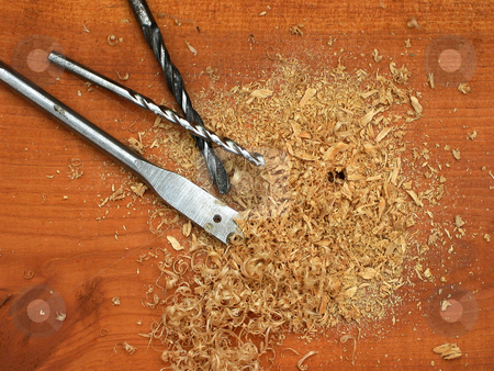 To use this stock image in your creative project, please select the size you need over to the right and click the "Add to Cart" button.
Your downloaded image will come with the Cutcaster watermark removed so don’t worry about the watermark you see on this page. Bits and pieces stock photo, Several drill bits resting in sawdust on board. by Clay Anthony