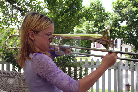To use this stock image in your creative project, please select the size you need over to the right and click the "Add to Cart" button.
Your downloaded image will come with the Cutcaster watermark removed so don’t worry about the watermark you see on this page. Natural trombonist 2 stock photo, Pre-teen girl with sunglasses playing trombone outside. by Clay Anthony