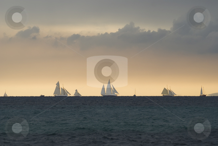 To use this stock image in your creative project, please select the size you need over to the right and click the "Add to Cart" button.
Your downloaded image will come with the Cutcaster watermark removed so don’t worry about the watermark you see on this page. Regatta on the horizon stock photo, Old sailboats on the horizon near Cannes (french riviera) during