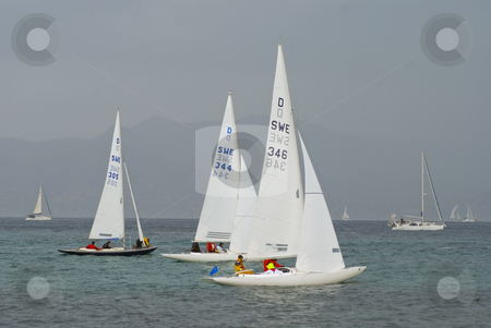 To use this stock image in your creative project, please select the size you need over to the right and click the "Add to Cart" button.
Your downloaded image will come with the Cutcaster watermark removed so don’t worry about the watermark you see on this page. Regatta during a raining day stock photo, Sailboats of type