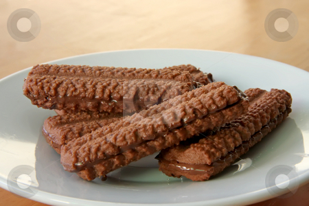 To use this stock image in your creative project, please select the size you need over to the right and click the "Add to Cart" button.
Your downloaded image will come with the Cutcaster watermark removed so don’t worry about the watermark you see on this page. Chocolate venetians stock photo, Chocolate venetian cookies cocoa biscut sandwiches with icing by Kheng Guan Toh