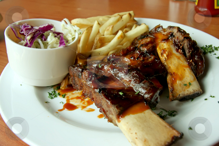 To use this stock image in your creative project, please select the size you need over to the right and click the "Add to Cart" button.
Your downloaded image will come with the Cutcaster watermark removed so don’t worry about the watermark you see on this page. Beef ribs stock photo, Barbecued beef ribs with french fries on white plate by Kheng Guan Toh