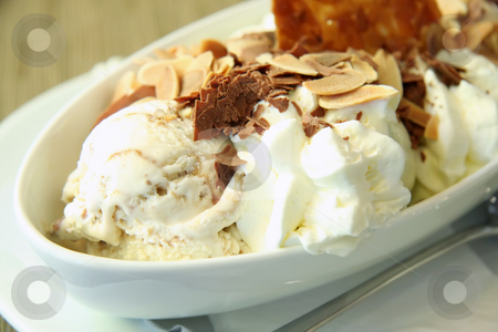 To use this stock image in your creative project, please select the size you need over to the right and click the "Add to Cart" button.
Your downloaded image will come with the Cutcaster watermark removed so don’t worry about the watermark you see on this page. Ice cream sundae stock photo, Fancy ice cream sundae with flaked nuts and crushed chocolate by Kheng Guan Toh