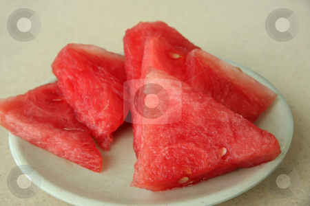 To use this stock image in your creative project, please select the size you need over to the right and click the "Add to Cart" button.
Your downloaded image will come with the Cutcaster watermark removed so don’t worry about the watermark you see on this page. Sliced watermelon stock photo, Cut red watermelon slices on a white plate by Kheng Guan Toh