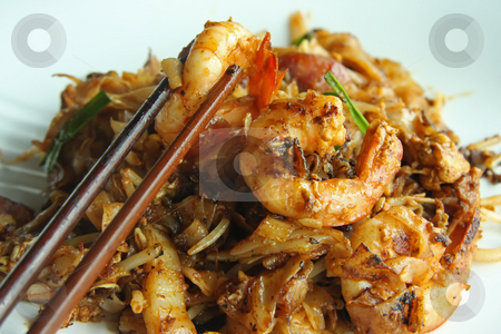 To use this stock image in your creative project, please select the size you need over to the right and click the "Add to Cart" button.
Your downloaded image will come with the Cutcaster watermark removed so don’t worry about the watermark you see on this page. Fried asian noodles stock photo, Fried flat rice noodles traditional chinese malaysian cuisine by Kheng Guan Toh
