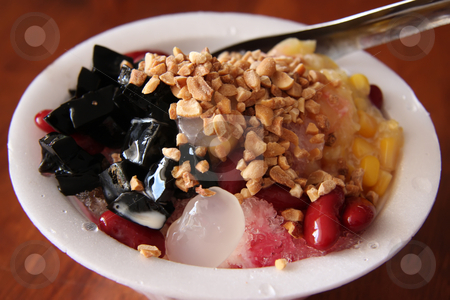 To use this stock image in your creative project, please select the size you need over to the right and click the "Add to Cart" button.
Your downloaded image will come with the Cutcaster watermark removed so don’t worry about the watermark you see on this page. Shaved ice dessert stock photo, Traditional asian dessert of shaved ice by Kheng Guan Toh