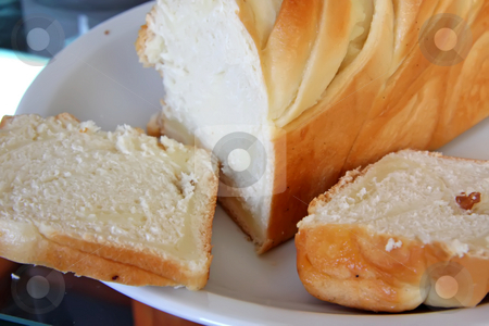 To use this stock image in your creative project, please select the size you need over to the right and click the "Add to Cart" button.
Your downloaded image will come with the Cutcaster watermark removed so don’t worry about the watermark you see on this page. Sweet german bread stock photo, Sweet german milk bread pastry whole loaf by Kheng Guan Toh