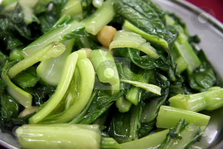 To use this stock image in your creative project, please select the size you need over to the right and click the "Add to Cart" button.
Your downloaded image will come with the Cutcaster watermark removed so don’t worry about the watermark you see on this page. Fried asian vegetables stock photo, Plate of fried green leafy vegetables Asian cuisine by Kheng Guan Toh
