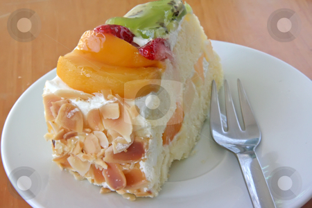To use this stock image in your creative project, please select the size you need over to the right and click the "Add to Cart" button.
Your downloaded image will come with the Cutcaster watermark removed so don’t worry about the watermark you see on this page. Cream cake stock photo, Cream chiffon cake with fruits and icing by Kheng Guan Toh