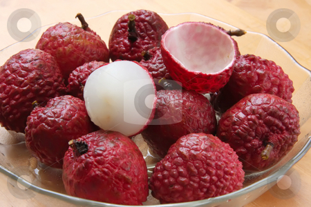 To use this stock image in your creative project, please select the size you need over to the right and click the "Add to Cart" button.
Your downloaded image will come with the Cutcaster watermark removed so don’t worry about the watermark you see on this page. Lychee fruits stock photo, Lychee fruits fresh whole pile unpeeled and peeled by Kheng Guan Toh