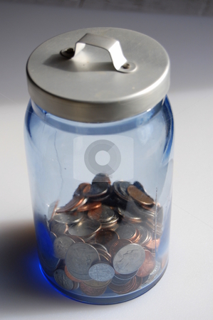 To use this stock image in your creative project, please select the size you need over to the right and click the "Add to Cart" button.
Your downloaded image will come with the Cutcaster watermark removed so don’t worry about the watermark you see on this page. Change jar stock photo, Collection of coins in a savings jar by Heather Shelley